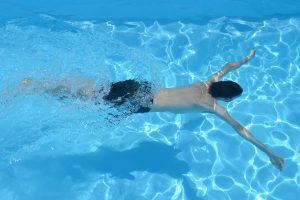 boy swimming in a pool